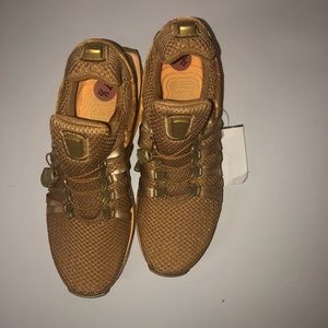 Metallic Gold Nike woman shoes